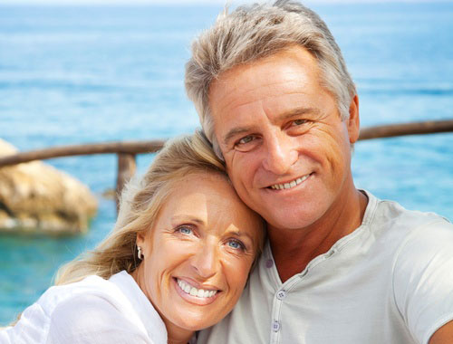 Middle aged couple on the beach