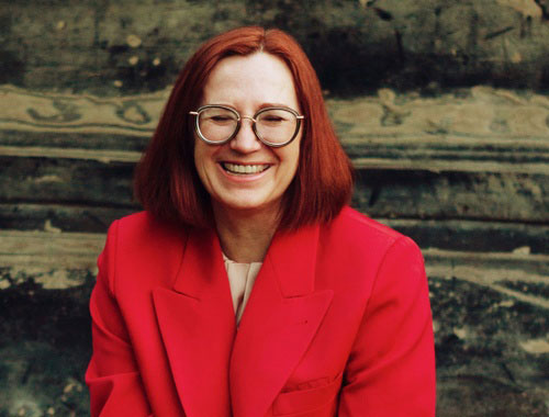 Smiling woman in fall coat